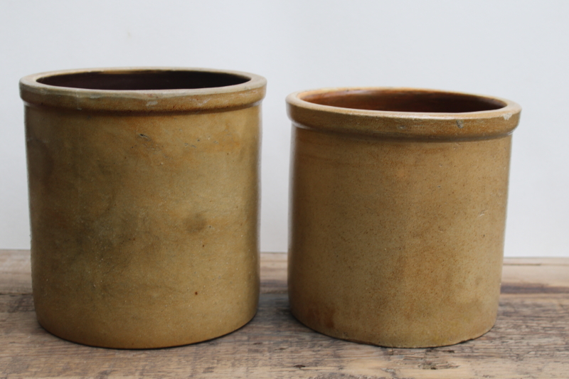 photo of two old worn browned stoneware crocks, large planter pots for trees or greenery, farmhouse kitchen storage  #17