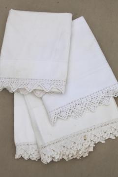 catalog photo of two pairs vintage all white cotton pillowcases w/ handmade crochet lace edgings