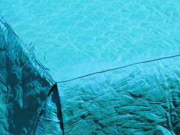 catalog photo of unused 60s vintage bedspread, peacock blue green color, quilted fabric