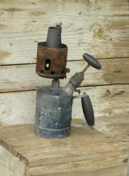 catalog photo of unusual primitive old tool blowtorch with copper or bronze burner