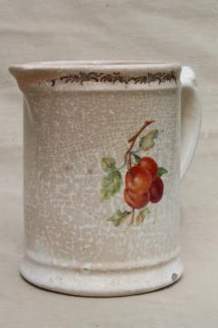 catalog photo of very old browned china pitcher w/ red apples, antique vintage Homer Laughlin milk jug