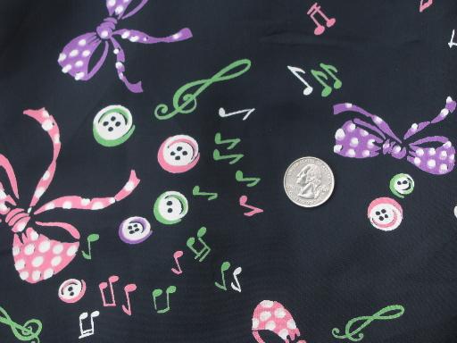 photo of vintage 50s print rayon fabric, jazzy bright buttons and bows on black #1