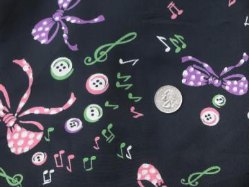 catalog photo of vintage 50s print rayon fabric, jazzy bright buttons and bows on black