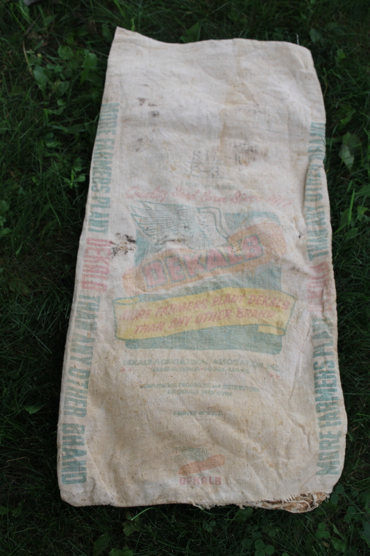 photo of vintage Dekalb advertising seed corn sacks, worn faded farm primitives, printed cotton grain bags  #9