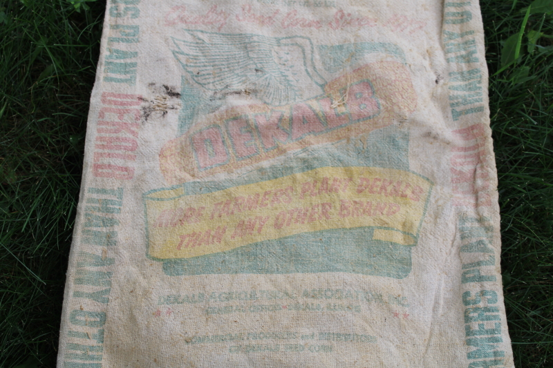 photo of vintage Dekalb advertising seed corn sacks, worn faded farm primitives, printed cotton grain bags  #10