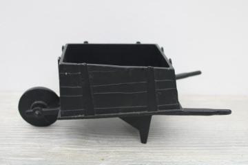 catalog photo of vintage Emig cast metal wheelbarrow, old fashioned garden planter pot w/ black iron finish