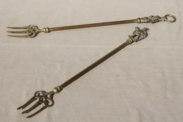 catalog photo of vintage English brass toasting forks, long handled forks w/ character handles