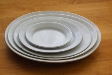 catalog photo of vintage English ironstone heavy white china platters stack big through small