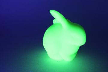 catalog photo of vintage Fenton bunny rabbit figurine, lime green uranium glass, glows in UV black light