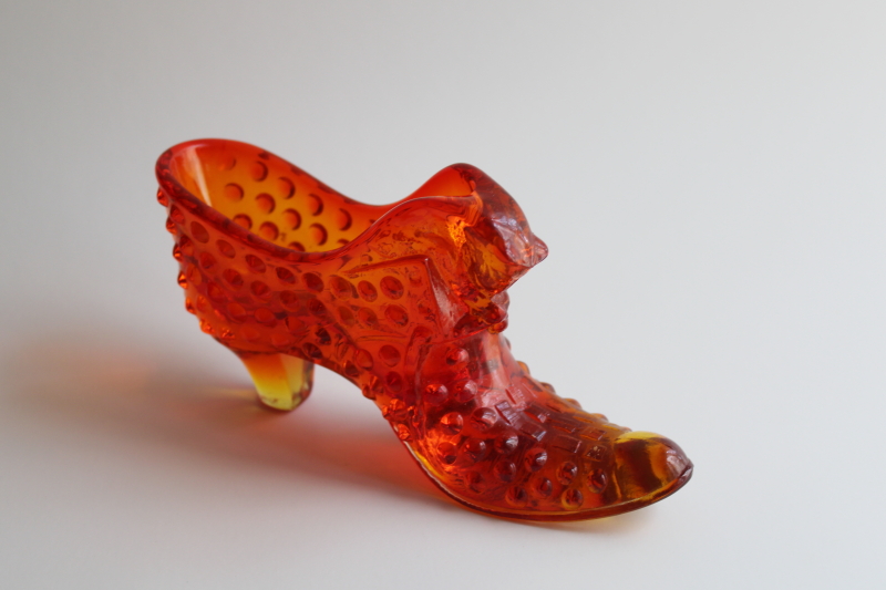 photo of vintage Fenton hobnail glass shoe, amberina red orange glass UV glow  #2