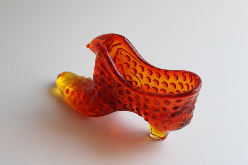 photo of vintage Fenton hobnail glass shoe, amberina red orange glass UV glow  #3