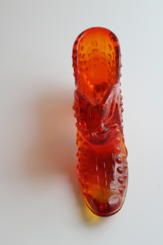 photo of vintage Fenton hobnail glass shoe, amberina red orange glass UV glow  #4