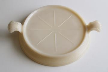 catalog photo of vintage Fire King ivory milk glass trivet, round casserole stand with tray handles 