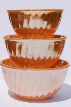 catalog photo of vintage Fire-King peach luster glass mixing bowl nest, nesting swirl bowls