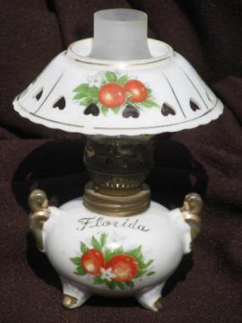 catalog photo of vintage Florida souvenir, oranges print mini oil lamp w/ china shade