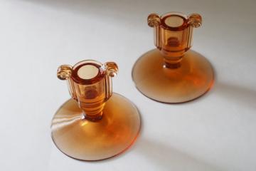 catalog photo of vintage Fostoria amber glass candle holders, pair of single candle sticks scroll pattern 