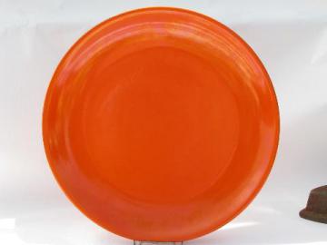 catalog photo of vintage Gladding-McBean Franciscan California pottery chop or cake plate, retro orange