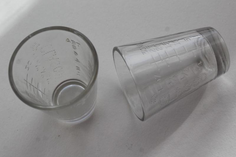 photo of vintage Glasco medicine glasses, shot glass size w/ embossed measures marked doses #1