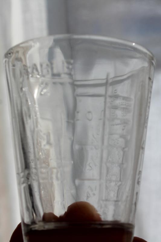 photo of vintage Glasco medicine glasses, shot glass size w/ embossed measures marked doses #4