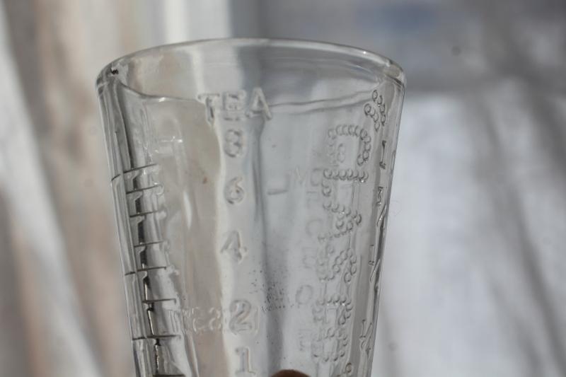 photo of vintage Glasco medicine glasses, shot glass size w/ embossed measures marked doses #5