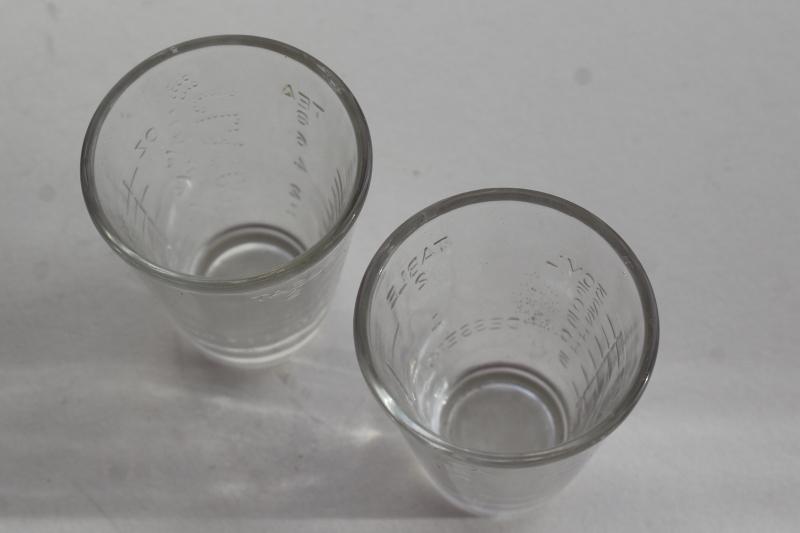 photo of vintage Glasco medicine glasses, shot glass size w/ embossed measures marked doses #7