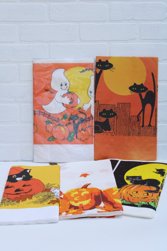 photo of vintage Halloween party tablecloths, orange crepe paper w/ black cat, white paper table covers w/ print borders #1