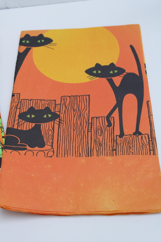 photo of vintage Halloween party tablecloths, orange crepe paper w/ black cat, white paper table covers w/ print borders #2