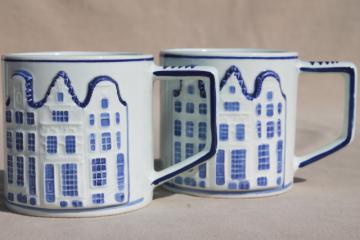 catalog photo of vintage Holland Delft mugs, blue & white handpainted coffee cups w/ Dutch row houses