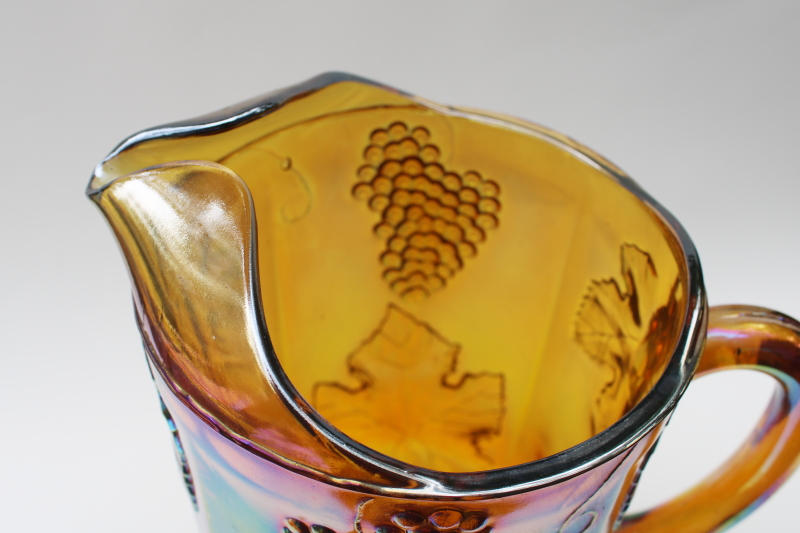 photo of vintage Indiana glass marigold amber gold carnival glass pitcher, grapes pattern #3