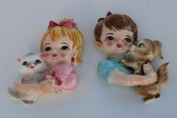 catalog photo of vintage Japan hand painted ceramic wall plaques, girl w/ kitten, boy w/ puppy
