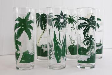 catalog photo of vintage Libbey tiki zombie glasses, tall tumblers w/ tropical scenes, palm trees