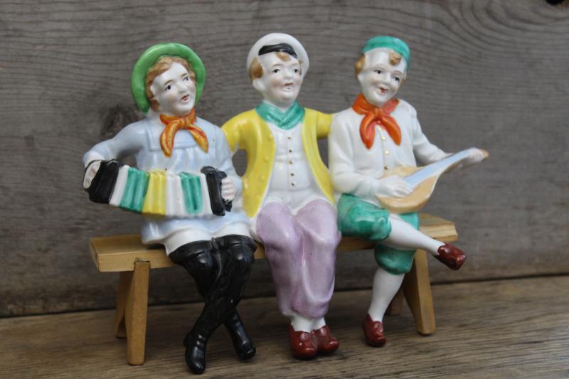 photo of vintage Made in Japan hand painted figurine, jolly sailors band shelf sitter w/ wood bench #1