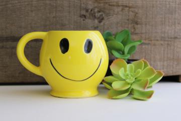 catalog photo of vintage McCoy pottery mug, smiley face yellow smile coffee cup, 60s 70s retro