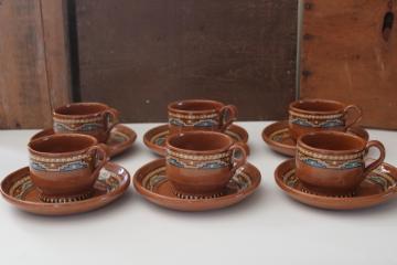 catalog photo of vintage Mexican pottery, small plates and mugs Aztec style hand painted red clay terracotta 