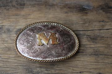 catalog photo of vintage Montana Silversmiths sterling over copper western belt buckle letter M monogram