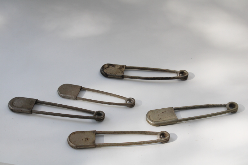 photo of vintage Risdon key tags, giant safety pins w/ old patent numbers, worn patina nickel plated brass #1