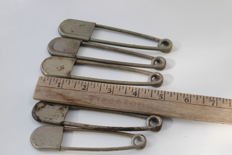 photo of vintage Risdon key tags, giant safety pins w/ old patent numbers, worn patina nickel plated brass #2