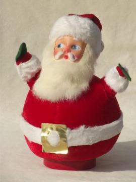 catalog photo of vintage Santa w/ rabbit fur beard, roly-poly red flocked velvet music box