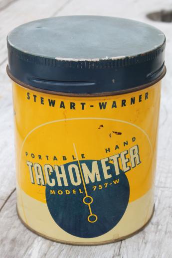 photo of vintage Stewart Warner 757W hand tachometer in tin case, 1940s garage or racing pit #7