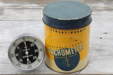 catalog photo of vintage Stewart Warner 757W hand tachometer in tin case, 1940s garage or racing pit