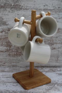 catalog photo of vintage Syracuse china chunky white ironstone coffee mugs & wood mug tree cup holder rack 