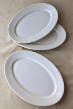 catalog photo of vintage Syracuse china white ironstone oval lobster dinner plates or platters