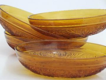 catalog photo of vintage Tiara sandwich glass soup bowls, daisy pattern amber glass