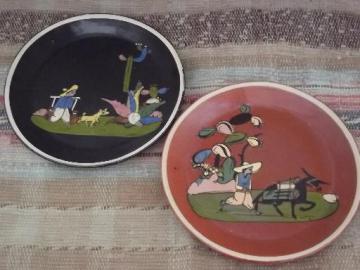 catalog photo of vintage Tlaquepaque Mexican painted pottery plates, one black, one red