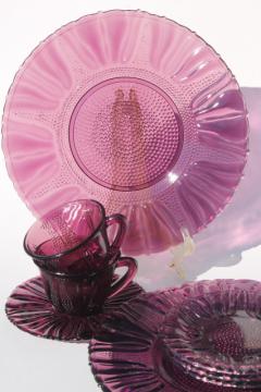catalog photo of vintage Tulip Dell pattern glass dishes, amethyst purple colored glass plates, cups & saucers
