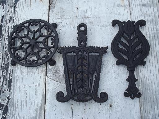 photo of vintage Wilton cast iron kitchen trivets, round and iron shape trivet lot #1