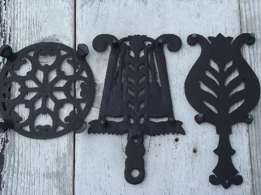 photo of vintage Wilton cast iron kitchen trivets, round and iron shape trivet lot #5