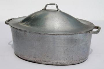 catalog photo of vintage aluminum oval roaster dutch oven, big roasting pan for camp cookware