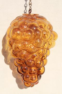 catalog photo of vintage amber glass grapes, figural bottle hanging sun catcher ornament