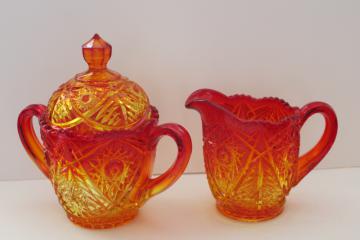 catalog photo of vintage amberina glass, large cream pitcher & covered sugar bowl hobstar pattern